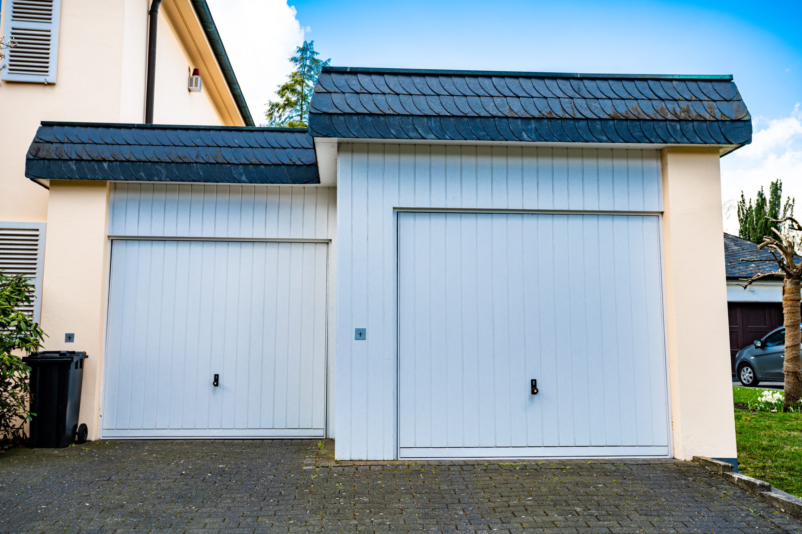 Wide garage door and concrete driveway