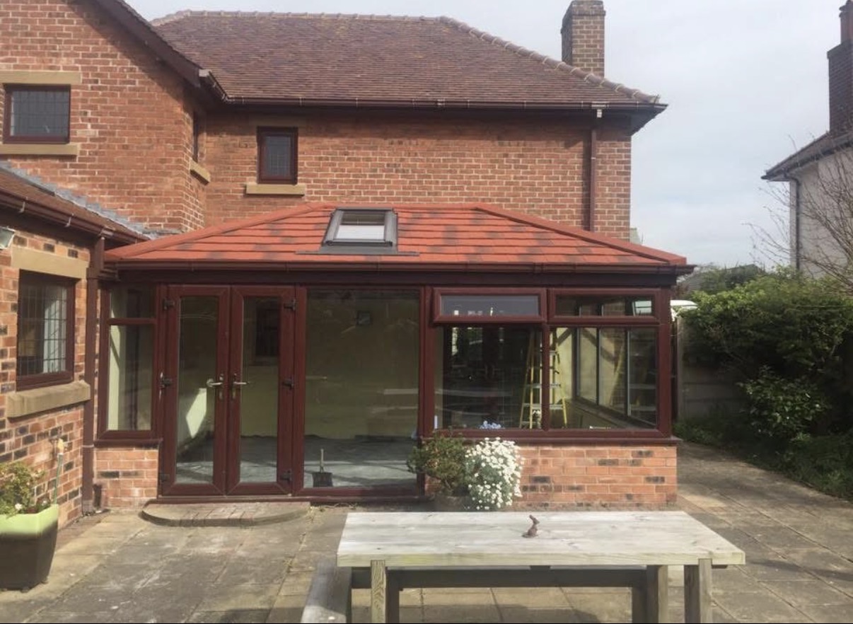Conservatory with a tiled replacement roof and rooflight